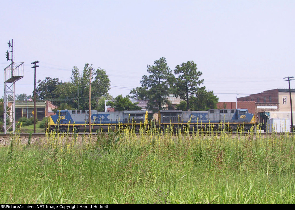 CSX 230 & 495 lead an empty coal train westbound